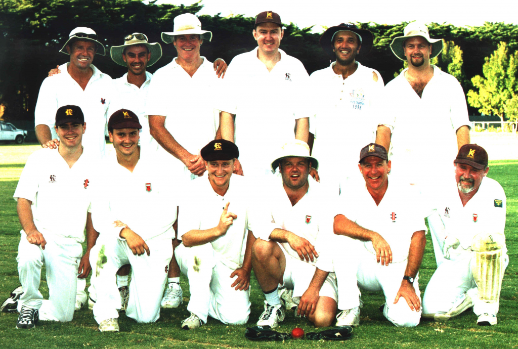 Photo of Keswick Cricket Club premiers 1999-00. Group of players with premiership cup.